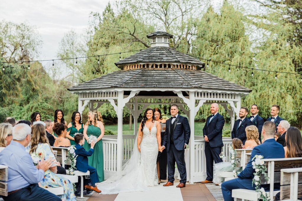Wedding ceremony at Flowerfield gazebo island.